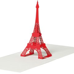 Carte pop-up ouverte montrant une découpe tridimensionnelle de la Tour Eiffel de couleur rouge vif